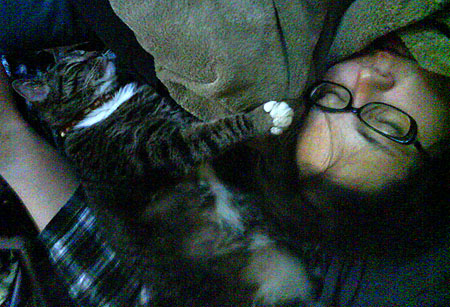 In this picture, leg of hubby (in plaid), Jiji and Sarah (Both asleep)