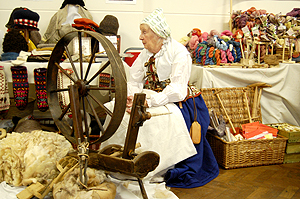 A lady in period dress and wheel looking REALLY uncomfortable the entire time I saw her