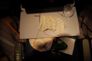 Mile-high lace knitting.  Note the empty scotch glass!