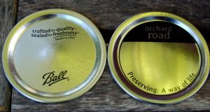 Ball wide mouth lid on left and Orchard Road wide mouth lid on right.
